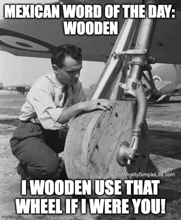 Man changing plane wheel. word: wooden